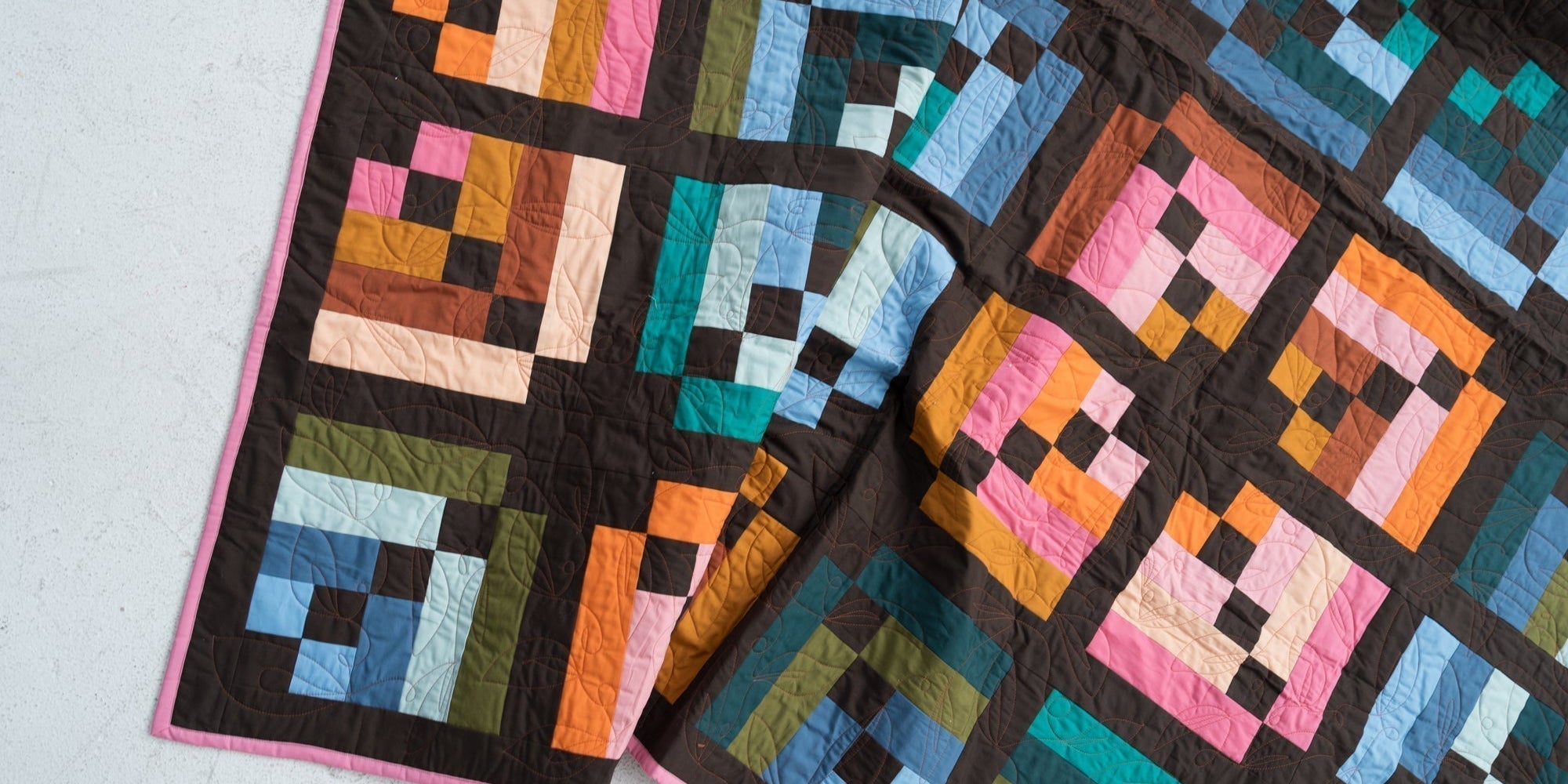 Toad & Sew Intertwined PDF modern quilt pattern detail – close‑up of multicolor stacked stripe blocks and chocolate brown sashing
